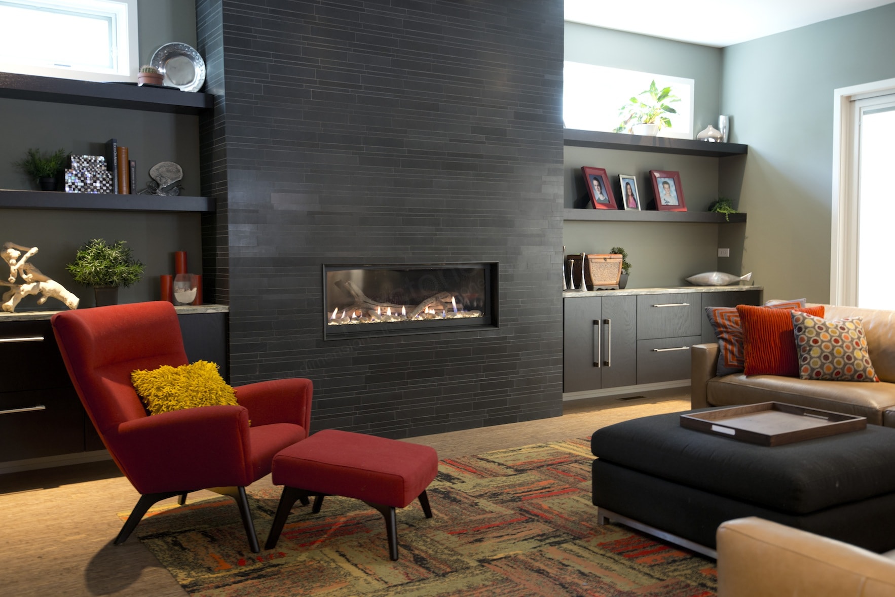 Modern inspired Living Room with prominent dark stone fireplace